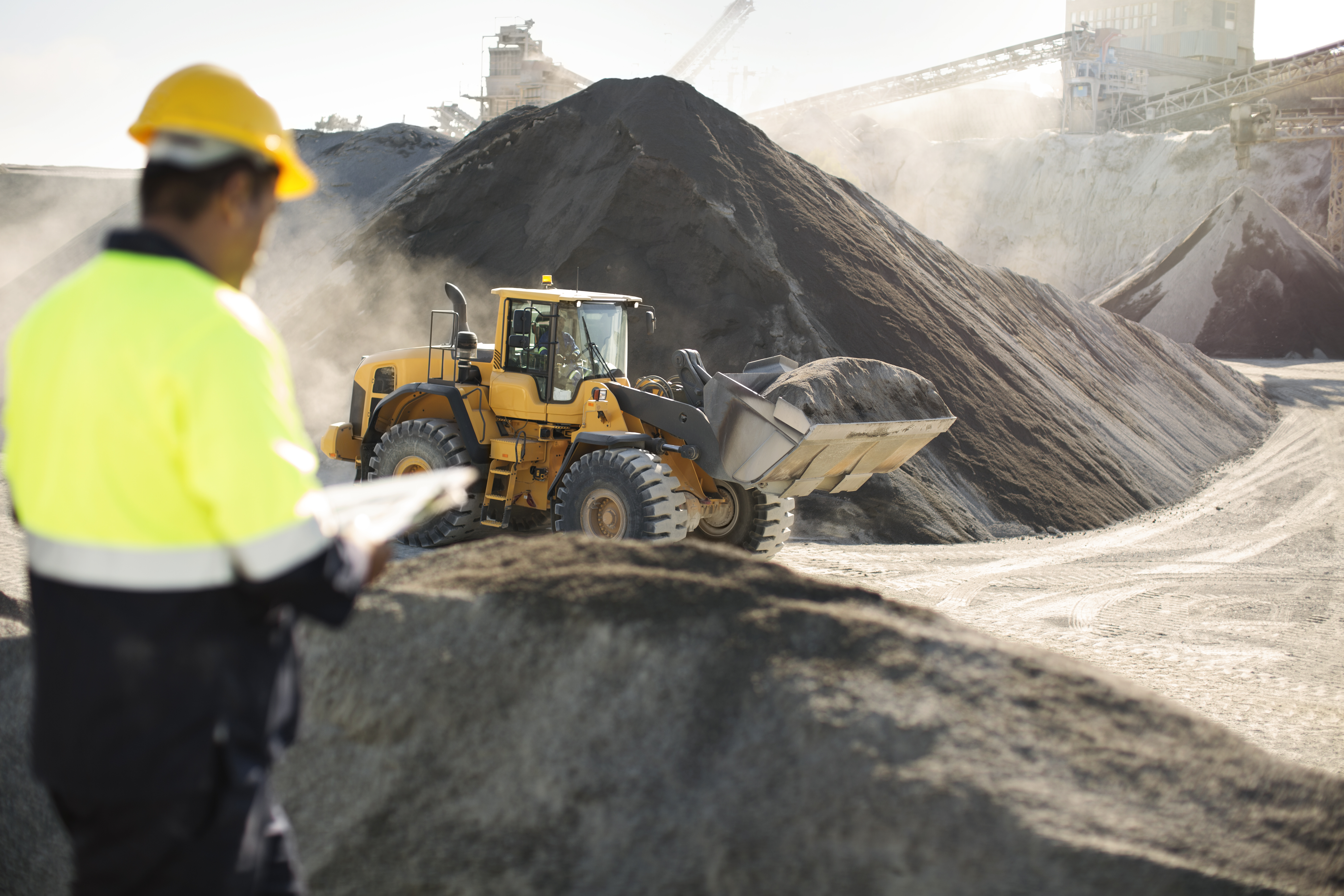 Site operator inspecting quarry operations as part of a dust control management plan.