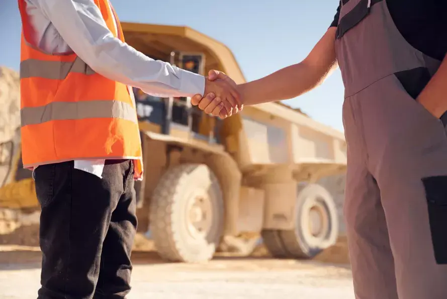 Image Of Work Men Shaking Hands On A Deal